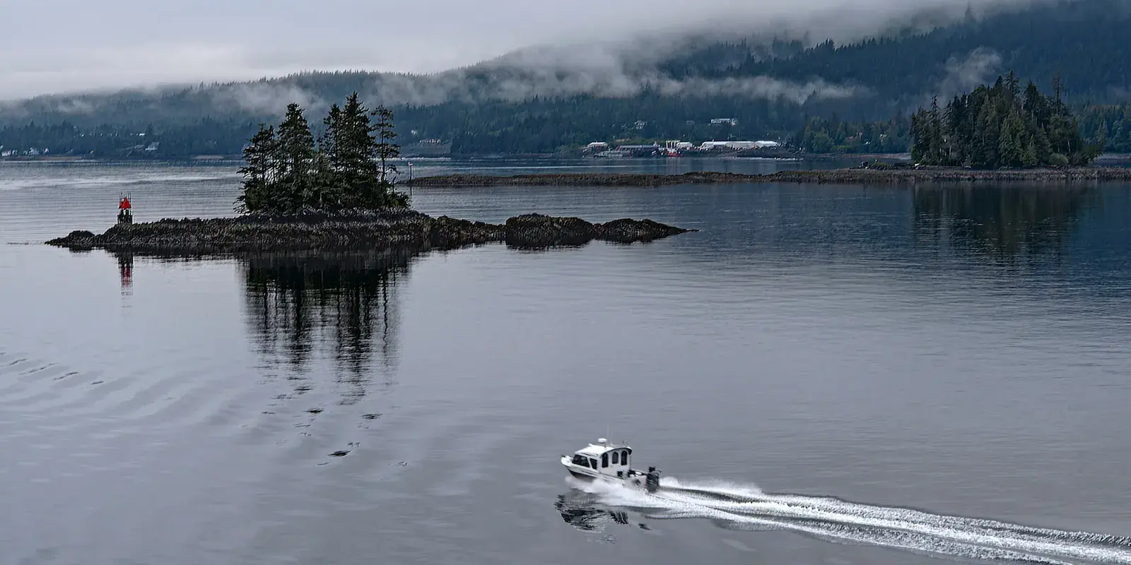 A boat crossing the calm waters near Ketchikan